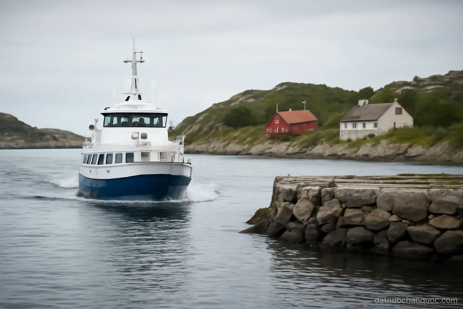 a small ferry approaching a stone jetty on a rocky island with a few houses along the shore